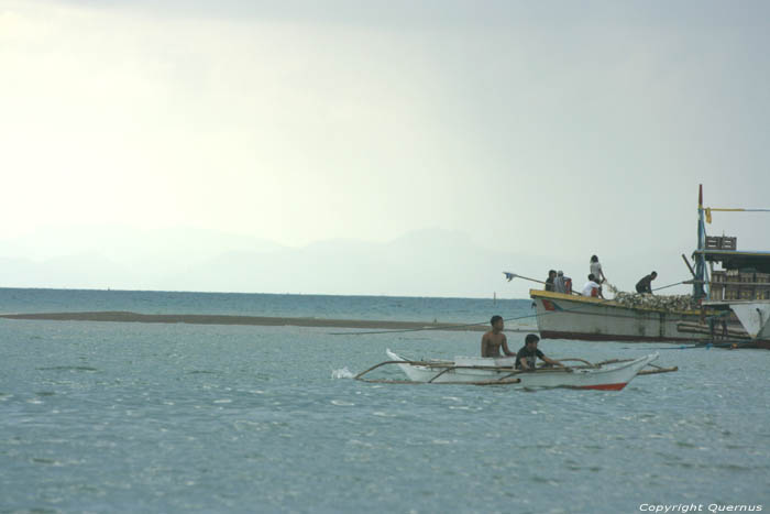 Beach and harbor Balatan / Philippines 