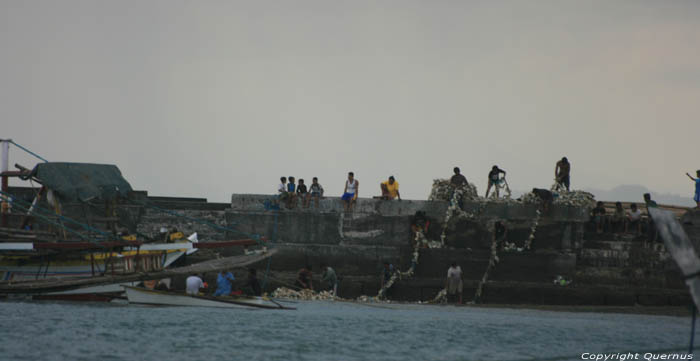 Beach and harbor Balatan / Philippines 