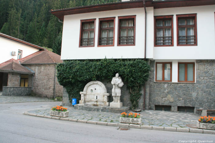 Statue of Gaida Player Shiroka Laka in Shiroka Luka / Bulgaria 