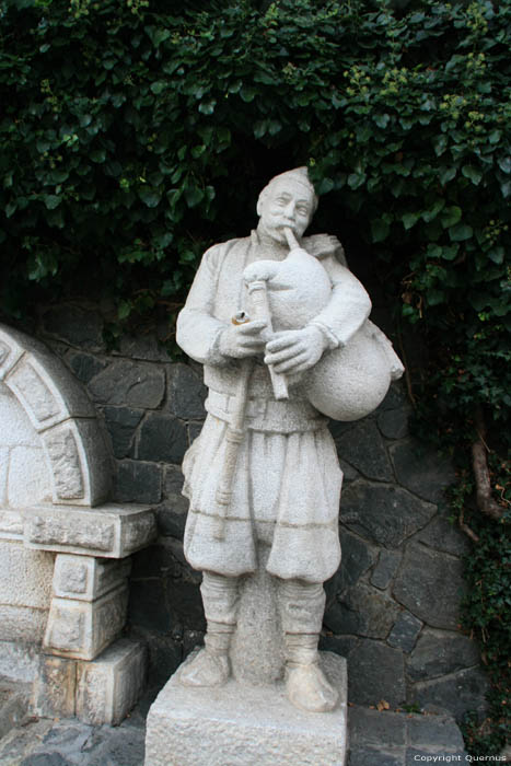 Statue of Gaida Player Shiroka Laka in Shiroka Luka / Bulgaria 