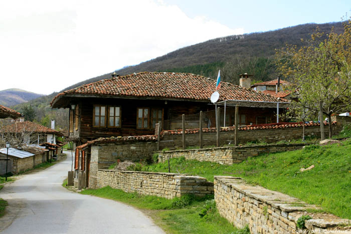 Wooden House with Flag Zheravna in Kotel / Bulgaria 