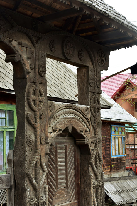 Old farmhouse with typical entrance gate for Maramures Mare / Romania 
