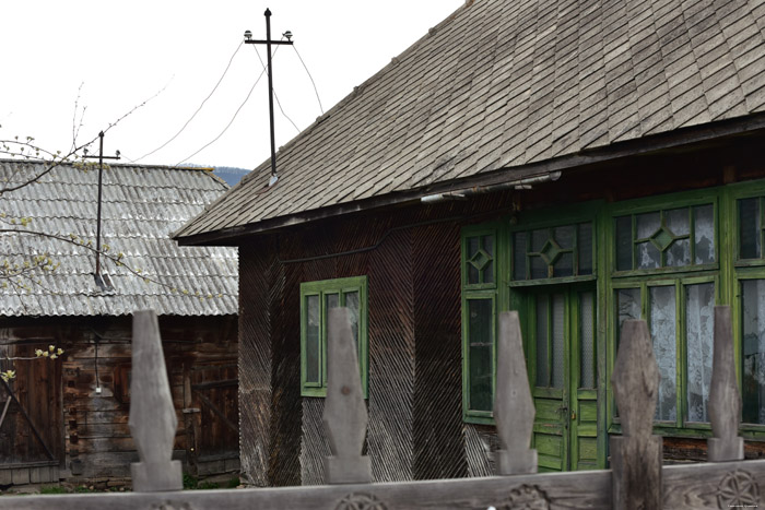 Old farmhouse with typical entrance gate for Maramures Mare / Romania 