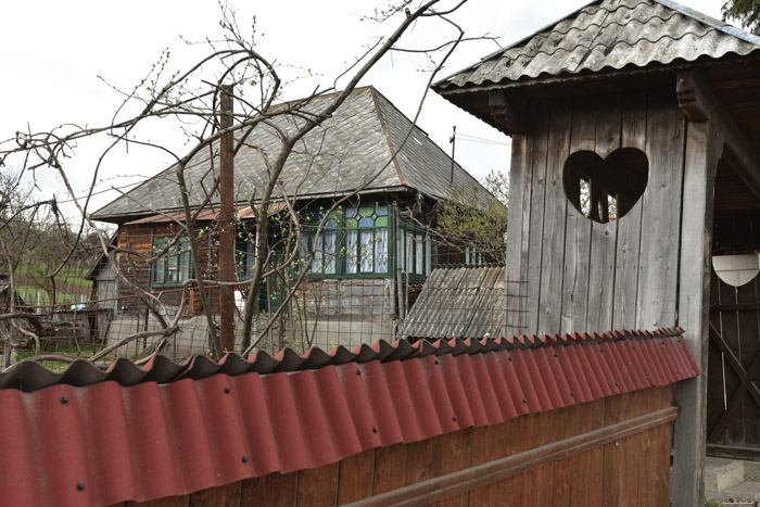 Wooden farm with gate with Hearts Mare / Romania 