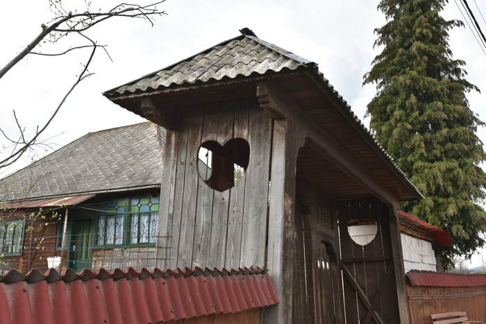 Wooden farm with gate with Hearts Mare / Romania 