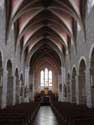 Sint-Pieterskerk KORTESSEM foto: Het oudste gedeelte is de middenbeuk die in romaanse stijl werd gebouwd tussen 1026 en 1275.